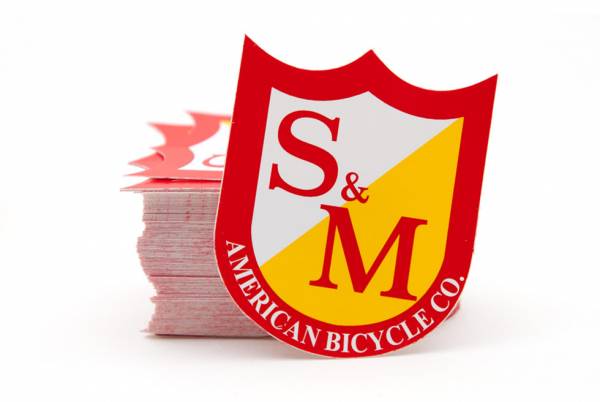 S&M STICKER SHIELD LOGO SINGLE Red/White/Yellow